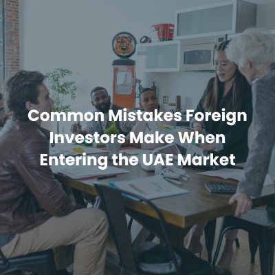Business meeting discussing common mistakes foreign investors make when entering the UAE market and business setup.