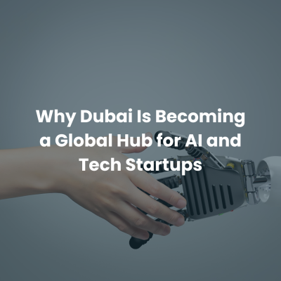 Human and robot hand touching with text about Dubai becoming a global hub for AI and tech startups.